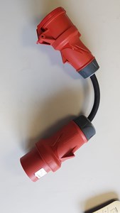 Picture of Red CEE male 32A to female 16A adapter